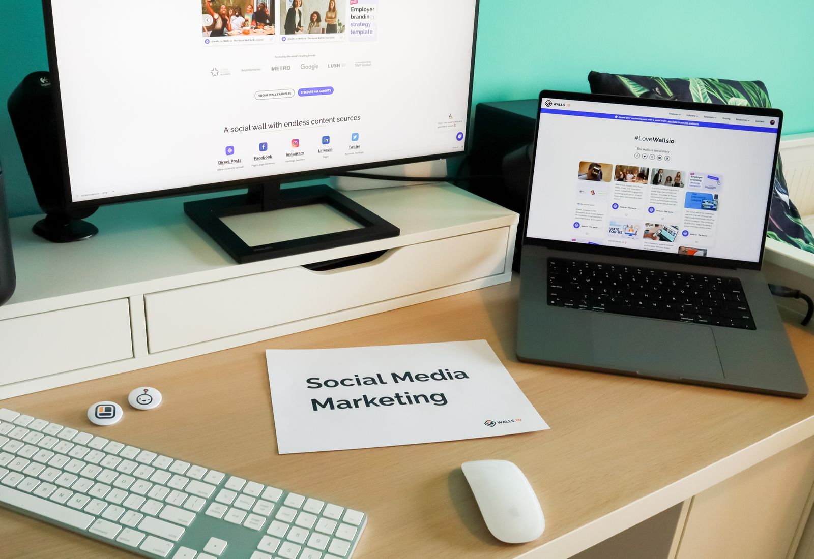 Marketing workspace with laptop and external monitor